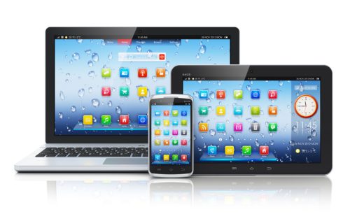 Mobile devices, mobility and telecommunication concept: metal business laptop or office notebook, tablet PC computer and modern black glossy touchscreen smartphone with colorful interface with application icons isolated on white background with reflection effect